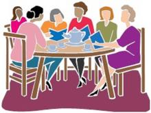 women at a table discussing books